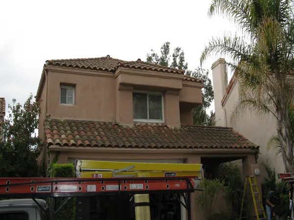 Pressure washing equipment cleaning a paved exterior surface