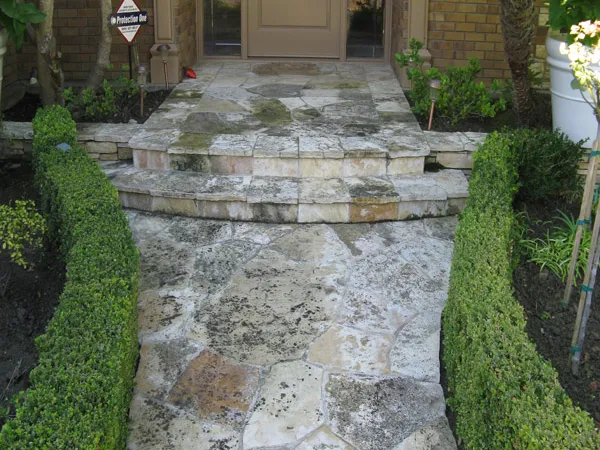 Pressure washing a residential exterior surface