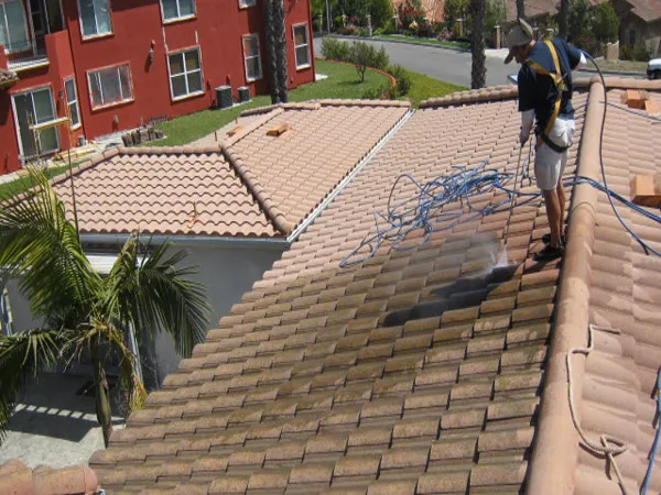 Tile roof cleaning in progress