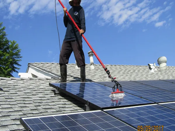 Solar panel cleaning on a residential roof